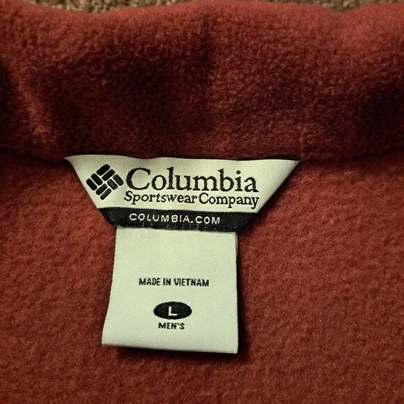Columbia fleece vest in a burnt orange or rust color. - Picture 7 of 7